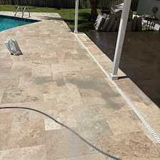 Travertine-Pool-Deck-Cleaning-Polymeric-Sand-Joint-Restoration-in-North-Palm-Beach-FL 4