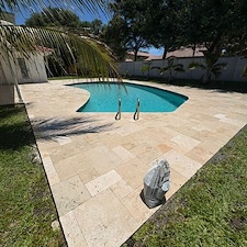 Travertine-Pool-Deck-Cleaning-Polymeric-Sand-Joint-Restoration-in-North-Palm-Beach-FL 2
