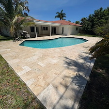 Travertine-Pool-Deck-Cleaning-Polymeric-Sand-Joint-Restoration-in-North-Palm-Beach-FL 1