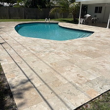 Travertine-Pool-Deck-Cleaning-Polymeric-Sand-Joint-Restoration-in-North-Palm-Beach-FL 0